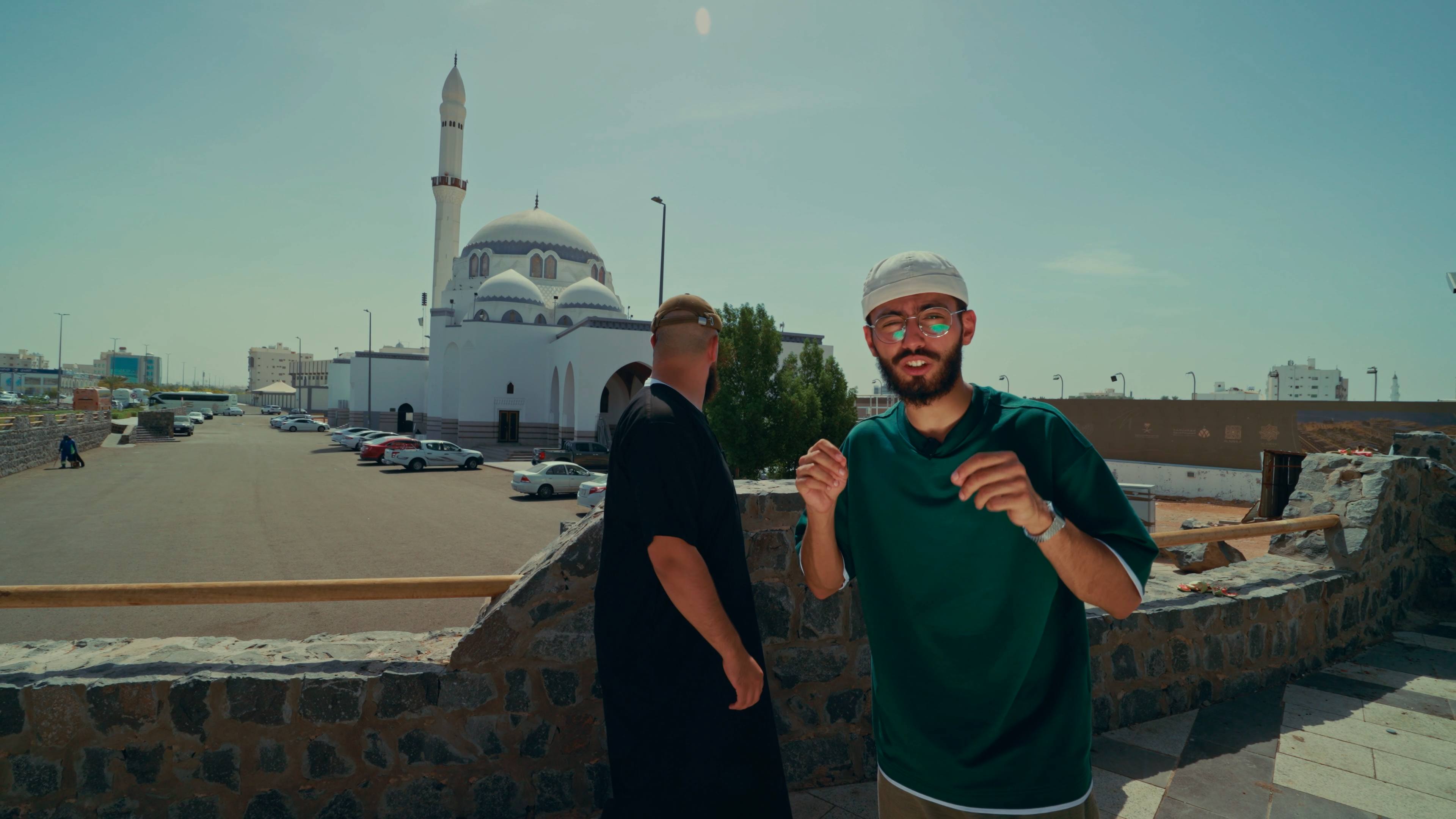 On location outside a white mosque