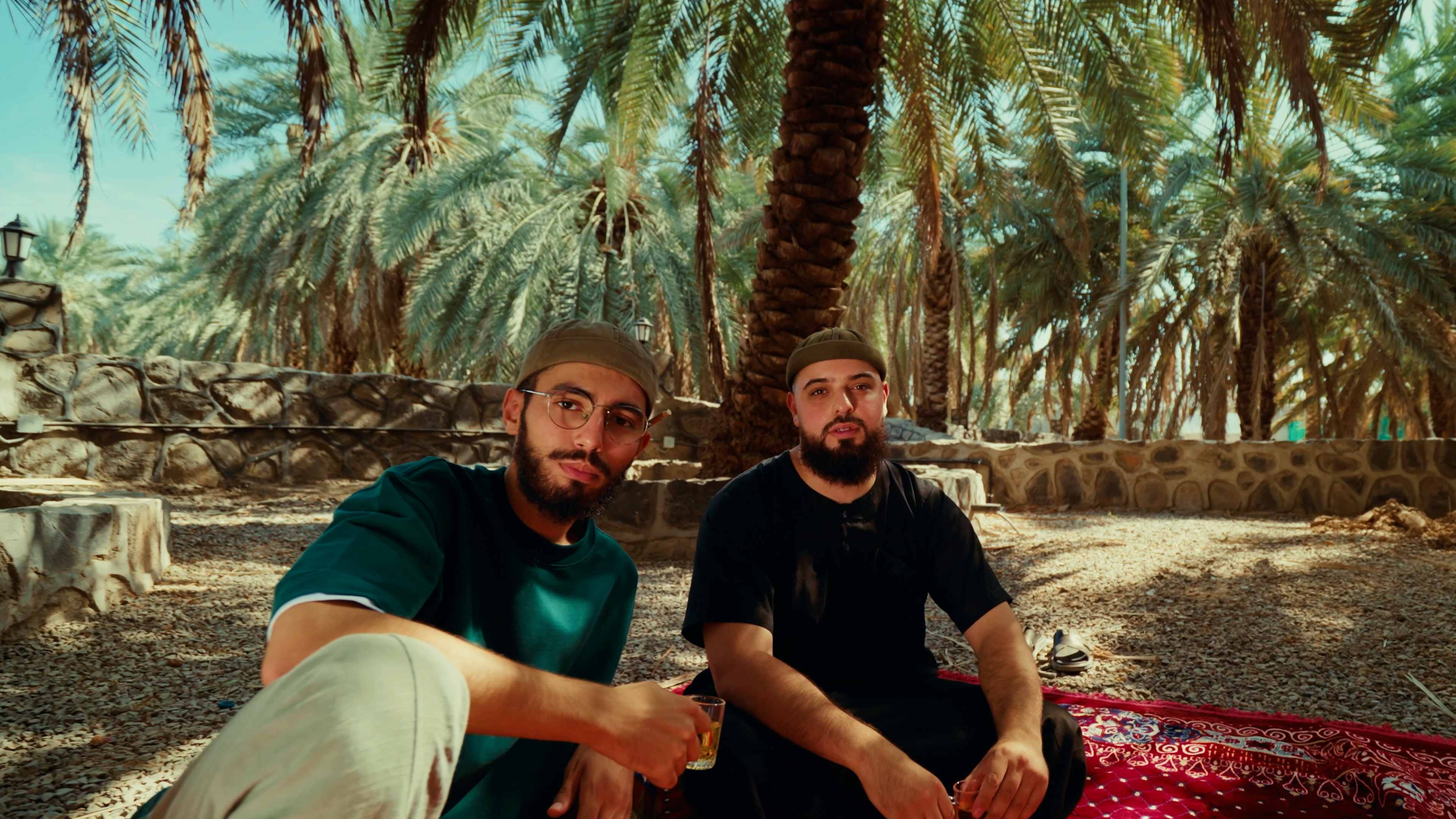 Hamza and Rafik filming among the palm groves